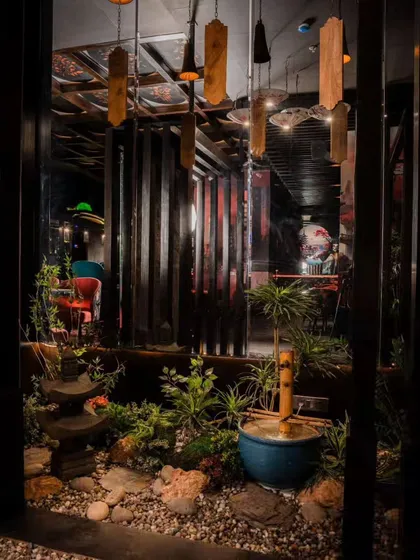 For this Japanese restaurant in Gurgaon, we designed and installed an indoor Zen garden to create a tranquil, immersive dining atmosphere. The space features a traditional stone lantern, a bamboo water feature, and carefully selected plants to complement the restaurant's theme.