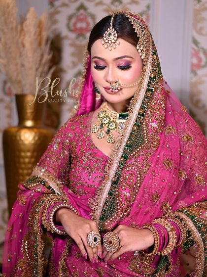 A soft, romantic pose capturing the essence of the bridal look. The closed-eye shot shows the smooth blending of the pink and purple eyeshadows, a key part of this signature eye makeup style.