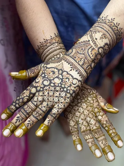 The back of the hands, featuring a unique design with netting and floral cuffs.