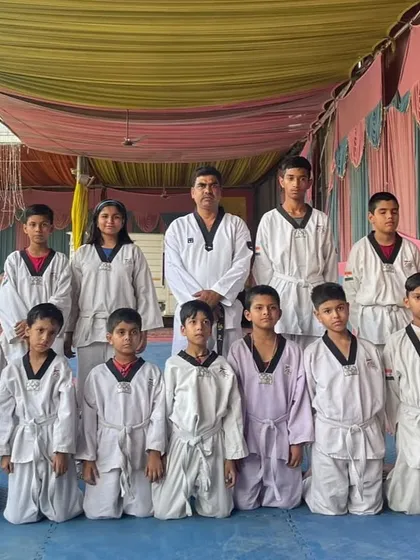 A group photo of our students after a successful Color Belt Promotion Test. Each student has earned their new rank through dedication.