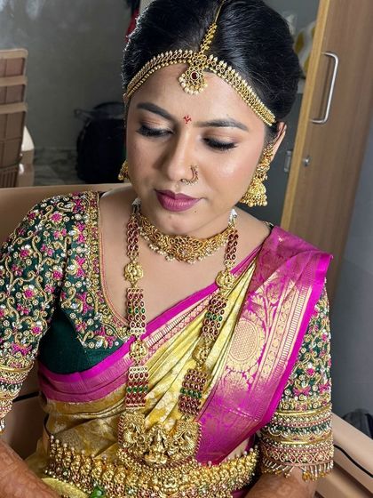 A close-up of this stunning muhurtham makeup. The eyeshadow is blended perfectly, and the lip color complements the rich tones of her saree and jewellery.