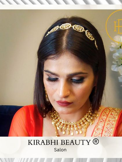 A classic and regal look for a special occasion. The client's makeup is kept minimal to let her beautiful gold jewelry and red outfit shine.