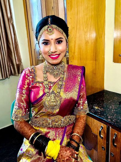 A full and bright shot of the bride, showcasing how our jewellery complements the vibrant colours of her saree.