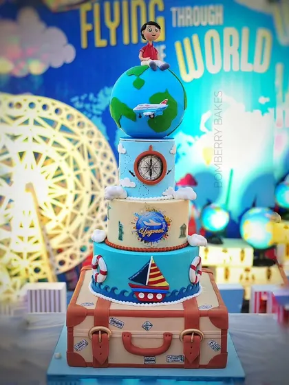 For a 5th birthday, I created this massive four-tier "Around the World" themed cake. The design features a rotating globe on top and a detailed suitcase base, showcasing my ability to handle large, intricate projects.
