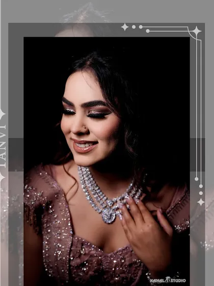 A close-up portrait of the bride, Tanvi, highlighting her stunning diamond necklace and flawless makeup.