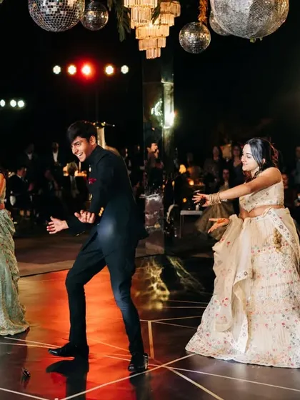 The groom joins in the family performance. It's always special when both sides of the family come together on the dance floor for a combined act.