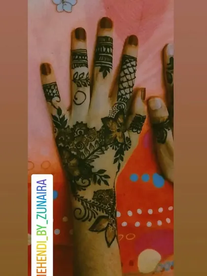A modern take on finger detailing. This design combines different patterns like leaves, swirls, and nets on each finger for a unique and stylish look.