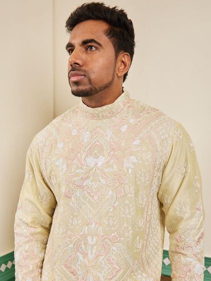 A portrait in the canary yellow kurta, capturing the richness of the embroidery.