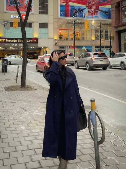 A candid street style shot on a Toronto city street in winter.