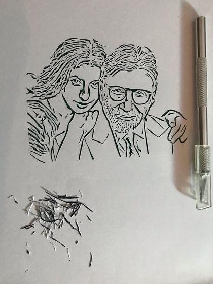 Here you can see the delicate lines of the portrait next to my craft knife. Creating this piece was a true labor of love.