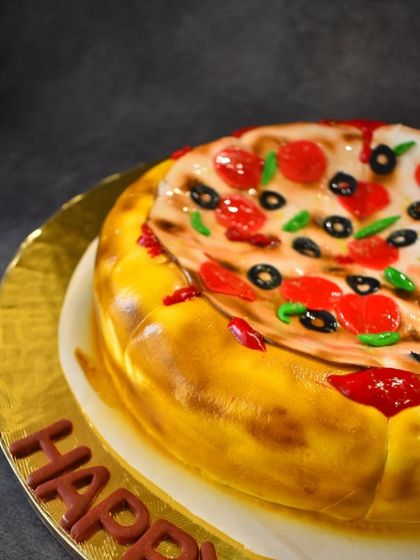 Is it a pizza or is it a cake? This is my fun illusion cake, which looks exactly like a pizza but is actually a delicious Nutella chocolate chip cake inside. Perfect for a surprise!
