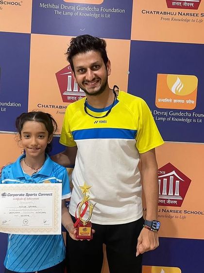 Nikita with her coach after her impressive win in the U-11 CSC Badminton tournament. This picture captures the strong bond between our coaches and students.