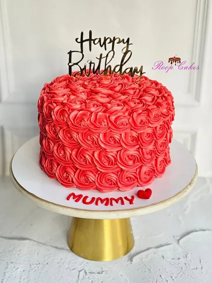 Roses, love, and cake, just for Mummy. This vibrant red cake is covered in beautifully piped rosettes, making it a perfect gift of love.