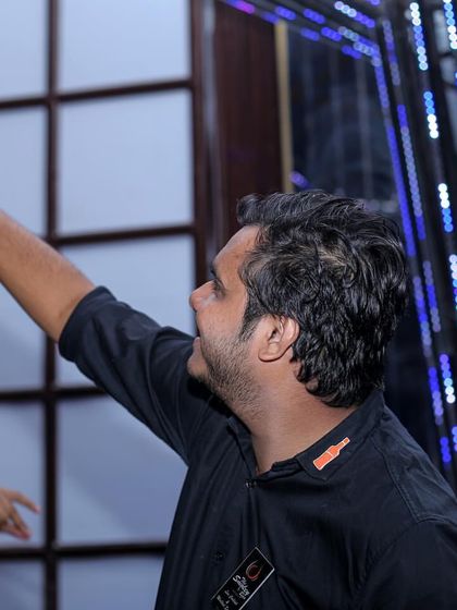 A flair bartender showing off his skills. My team members are entertainers who add a visual spectacle to the bar experience, delighting guests with their tricks.