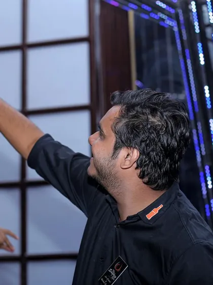 A flair bartender showing off his skills. My team members are entertainers who add a visual spectacle to the bar experience, delighting guests with their tricks.