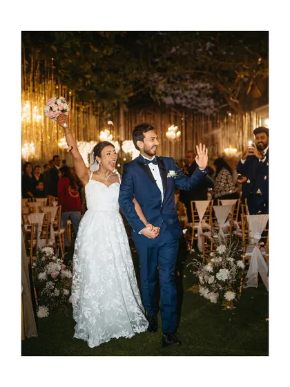 The pure, unfiltered joy of walking out hand-in-hand as husband and wife. We live for these moments of celebration, capturing the energy as you step into your forever, showered with love and flower petals.