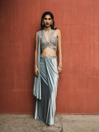 The full frontal view of the silver sari look. The silhouette is powerful and contemporary, perfect for a cocktail party or reception.