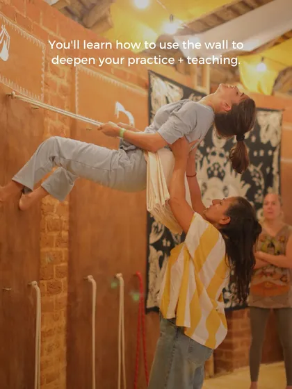 You will learn to use the Iyengar yoga wall as a powerful therapeutic tool. Here, we assist a student in a supported inversion, using ropes to decompress the spine and teach the principles of safe, restorative alignment.