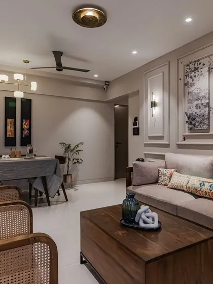 Here, the focus is on the custom-designed sofa and coffee table. The solid wood frame and rattan details of the furniture bring natural texture and warmth, creating a perfect setting for relaxation.