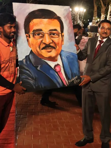 Beyond glitter art, I also create vibrant, full-color portraits live at events. This large canvas was painted on-site and presented as a gift, capturing the likeness and personality of the guest of honor.