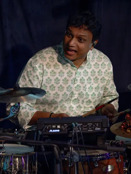 Another shot of our drummer, fully in the zone during a concert in Delhi. His ability to blend jazz drumming with Indian rhythmic concepts is incredible.