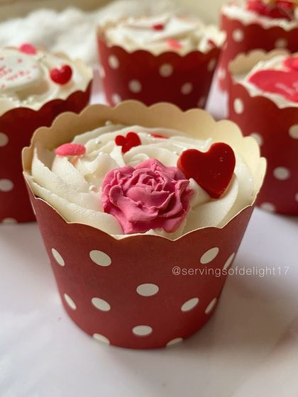 Perfect for Valentine's or just to show some love. These cupcakes are decorated with delicate pink roses and red hearts, all completely edible and handmade.