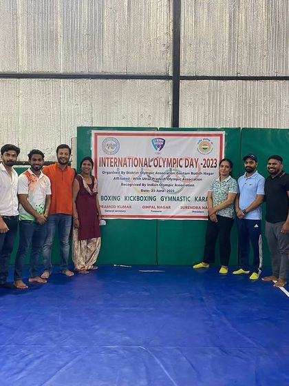 Another shot of our proud coaches and officials at the International Olympic Day event. We are a team, inside and out.