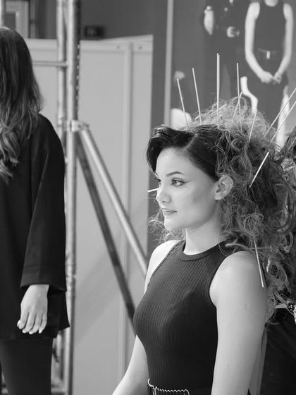 A behind-the-scenes moment from the Professional Beauty stage show, showcasing the teamwork and artistry that goes into these events.