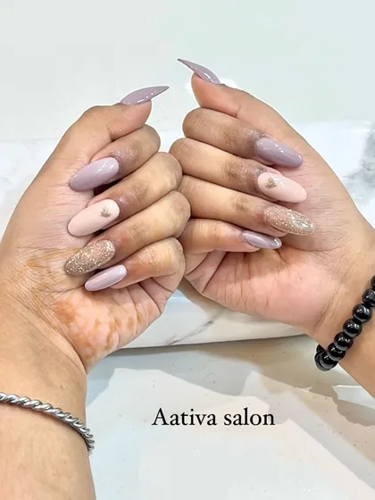 A lovely mix-and-match set using nude and pastel tones. We combined solid colors with a glitter accent nail for a soft and pretty look.