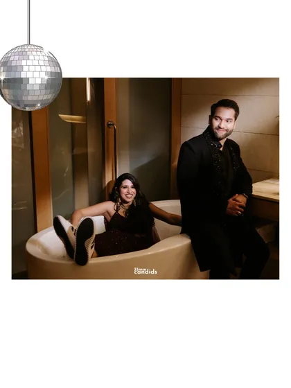 A quirky and fun shot of the couple in a bathtub, complete with a disco ball. This shows our willingness to get creative and capture the couple's unique personality.