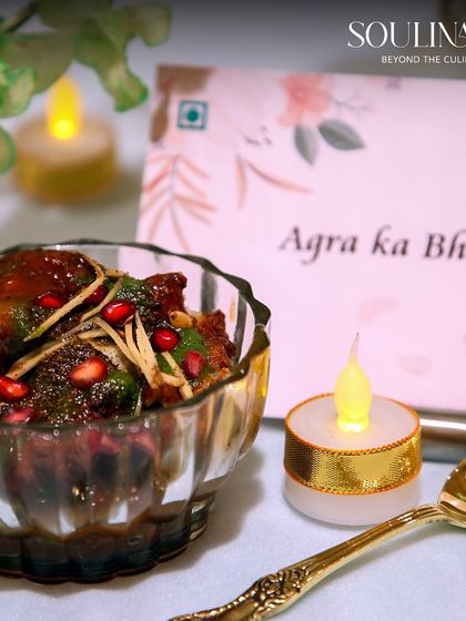 A serving of Agra ka Bhalla, a regional specialty, presented with modern flair in a crystal bowl. We bring authentic and diverse Indian street food flavours to our luxury wedding menus.
