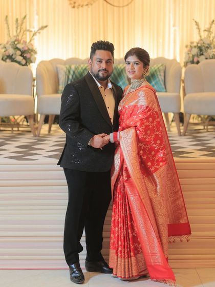 A classic portrait of the couple at their reception. The bride's makeup is timeless and elegant, designed to look beautiful in formal photographs.