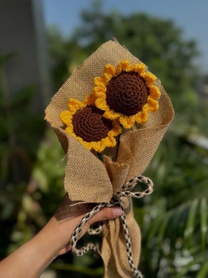 A sunny bouquet of two crochet sunflowers. This rustic arrangement is perfect for bringing a bit of the outdoors inside.