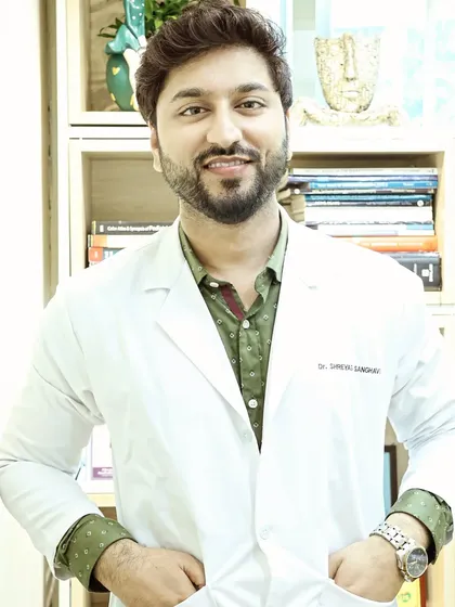 A candid shot of me in my doctor's coat at the clinic. My mission is simple: to help make the world a little healthier and more beautiful, one client at a time.