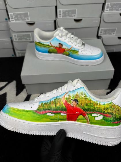 A custom Nike Air Force 1 celebrating golf legend Tiger Woods, with a hand-painted scene from the Augusta National Golf Club.