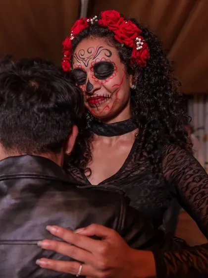 We love a good theme party. A dancer showcases her incredible Day of the Dead makeup during our annual Halloween social, where creativity and community come together on the dance floor.