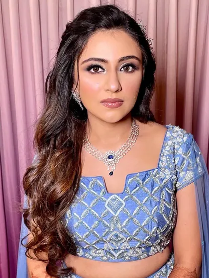 A more serious portrait, showing off the beautiful makeup and hair.