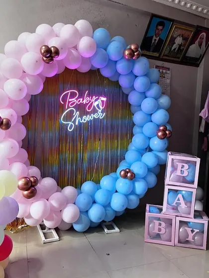 A slightly different angle of the pink and blue baby shower ring, showing how it fits perfectly in a home corner.
