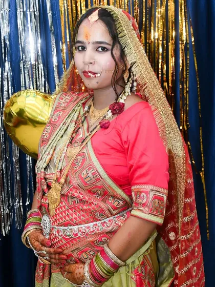 A stunning portrait of an expecting mother dressed for her traditional baby shower. We make sure to photograph the beautiful details of your attire.