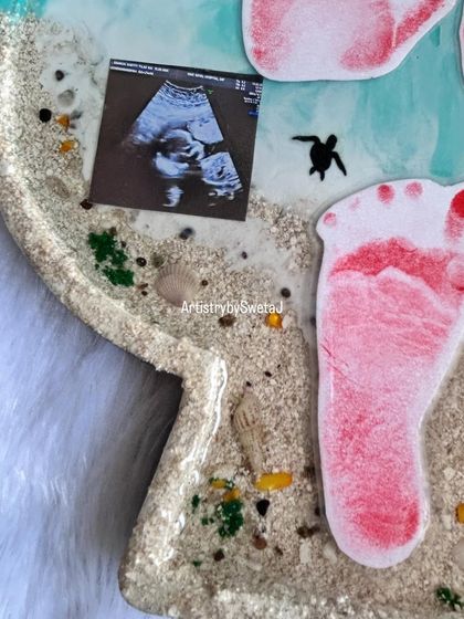 A detailed view of the preserved ultrasound photo, nestled in the sand with a tiny sea turtle accent. It’s these little details that make each piece so special.