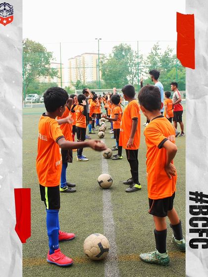 Learning the basics with focus and determination. Our players line up for a drill, listening to the coach's instructions, ready to execute the task.