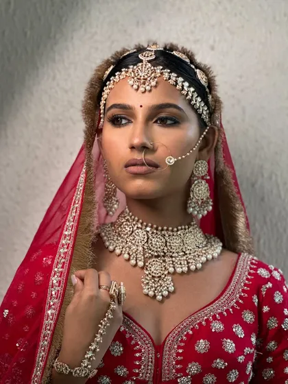 The elegance of this look is in its effortlessness. The makeup is strong enough to be regal but soft enough to let her natural beauty take center stage.