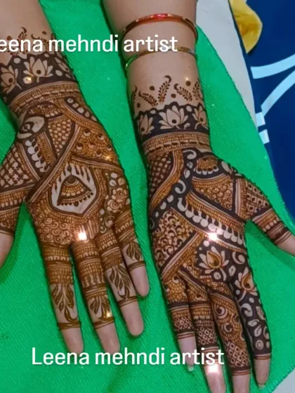A sparkling, fresh bridal mehndi design. The glitter adds a festive touch for the ceremony, highlighting the intricate patterns of peacocks and kalash motifs before the stain develops.