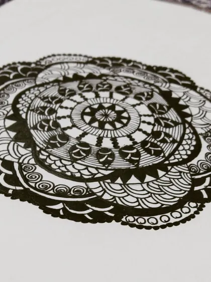 Here is a classic black and white mandala, where the focus is purely on the intricacy of the patterns. Using only black ink on paper, I built this design layer by layer, creating a complex and balanced piece that showcases the beauty of pure line work.