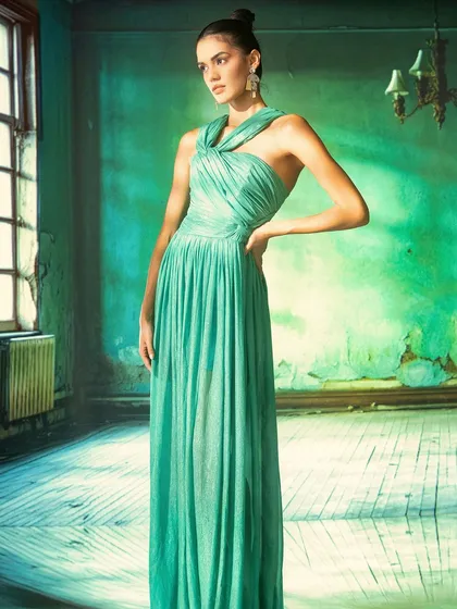 A moody, atmospheric room with peeling green paint, created using projection. This technique is perfect for building a specific character and story for an editorial fashion shoot.