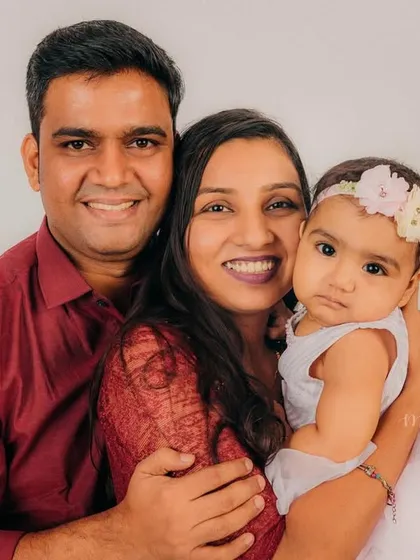 Another beautiful shot from the family session, capturing their loving interaction from a slightly different angle.