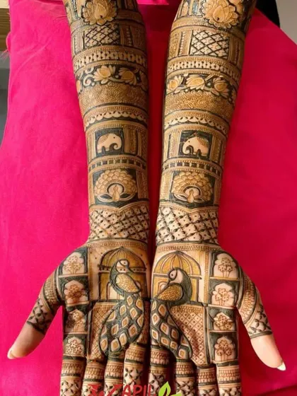 This design is a tribute to Rajasthani royalty. It features majestic peacocks on the palms and rows of elephants on the arms, all framed within beautiful architectural patterns.