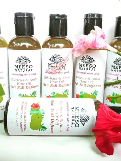 This is our Hibiscus & Amla Hair Oil, a customer favorite for tackling hair fall. We craft this hair fall defense oil using a traditional Ayurvedic blend of 6 different oils and 14 special herbs from our Nani's recipe book to strengthen roots and promote new growth.