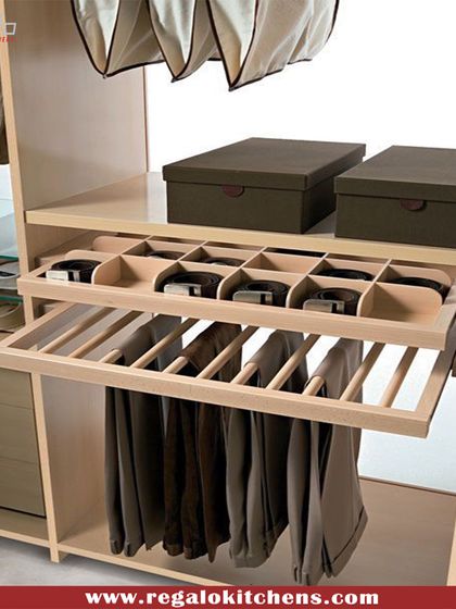 This pull-out organizer combines a trouser rack with a belt and tie compartment, offering a compact and highly efficient solution for men's accessories.
