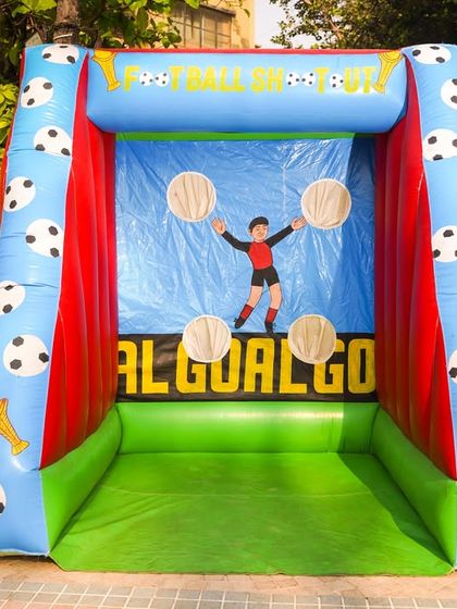 An inflatable "Football Shootout" game, a must-have for any sports-themed birthday party.